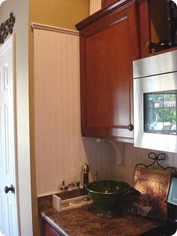 dark cabinets white beadboard